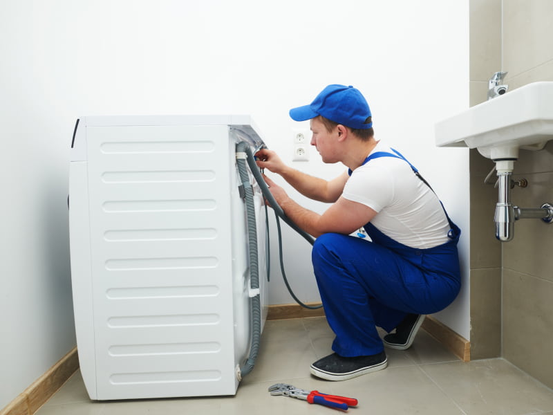 appliance repair contractor repairing a washer new hope pa